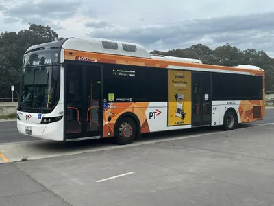 Route 901, the public bus that serves the airport — orange PTV livery with 'Airport 901' on the front display
