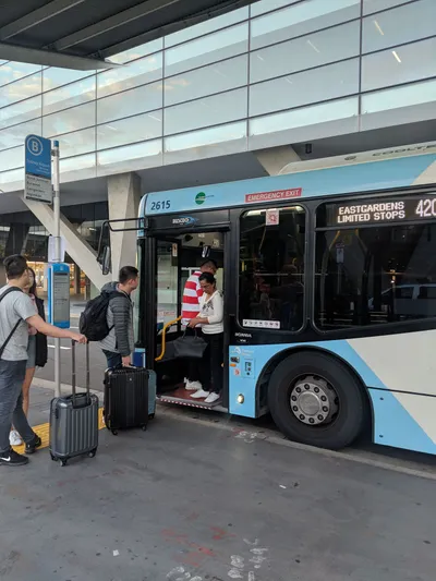 The bus stop at T1 (International) with route 420 to Eastgardens. Buses are not charged the station access fee.