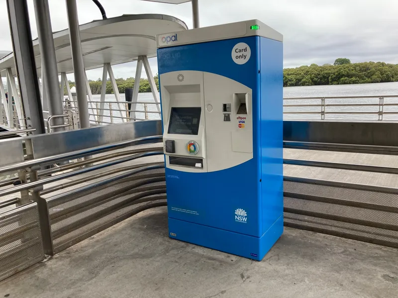An Opal top-up machine on a wharf, marked Card only — no cash.