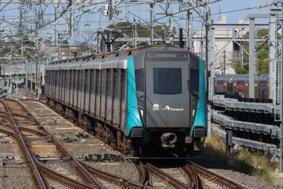 A Metro train. The turquoise front end sets it apart from the yellow Sydney Trains fleet.