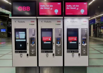 ÖBB ticket machines, photographed at Wien Hauptbahnhof. Airport tickets come from ÖBB/VOR-branded machines like these, not from the Wiener Linien machines that sell city tickets.