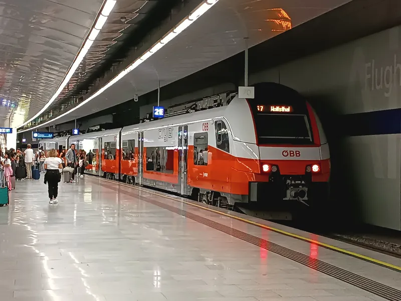 An ÖBB Cityjet at Vienna Airport station; the front display reads 'S7 Wolfsthal' — this is how you tell which way it goes.