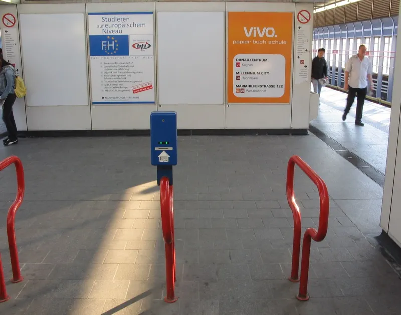 The blue validator (Entwerter) standing just short of the platform — paper tickets with a validation strip go in here. There are no fare gates.