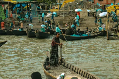 The steps where the crossing boats load — hulls nosed into the bank in a row