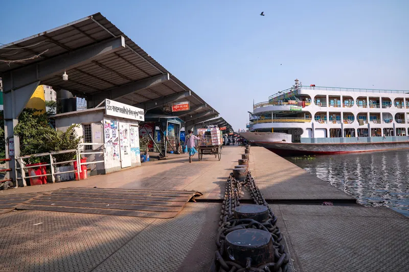 A floating pontoon at Sadarghat — each one carries its number and the places it serves (this is No. 9), and the launches berth by number