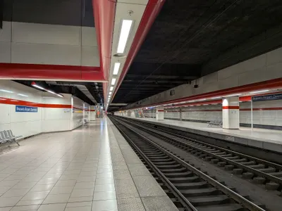 The airport station platform, underground beneath the terminal; the name boards read "Brussels Airport-Zaventem".