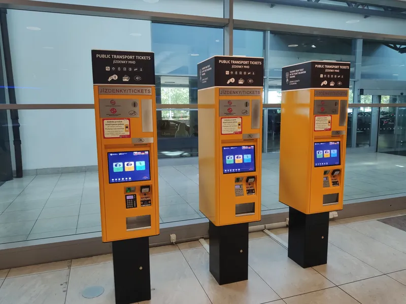 Ticket machines at Terminal 2, headed PUBLIC TRANSPORT TICKETS - buy here before you board