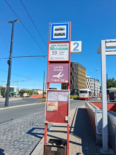 The city-side stop at Nádraží Veleslavín (metro A): line 59 is signed for "Letiště / Airport"