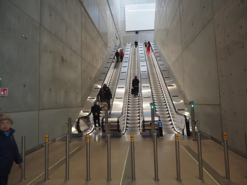 The escalators linking the terminal with the railway station beneath it.