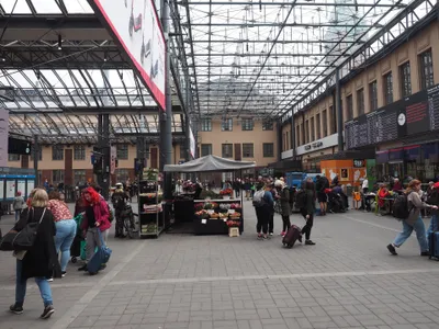 The concourse at Helsinki Central Station — there are no gates or barriers; passengers walk straight onto the platforms.