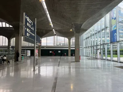 Wayfinding at Roissypôle — besides Terminals 1, 2 and 3 the sign lists "CDGVAL Airport Shuttle" and "Trains".