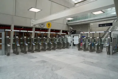 Validation gates — hold the card or phone over the reader in front of the doors