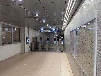 The gateline in the RER interchange hall at Gare de Lyon — on Paris rail you tap the same card or phone again to get out.
