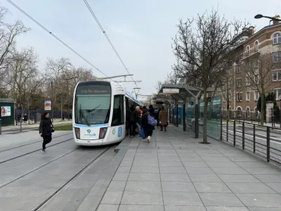 The stop sign reads "T3a — direction Porte de Vincennes", and the tram waiting at the platform is running that way. There are no gates; you board straight from the platform.