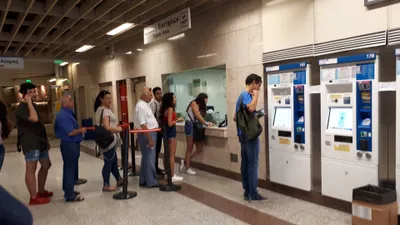 Ticket machines (right) and the staffed "Tickets Issue" counter inside a metro station — this is where you buy an Ath.ena ticket