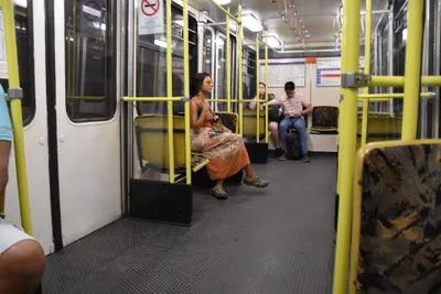 Inside a line M1 car - a small carriage lined with yellow poles, noticeably narrower than the other lines.