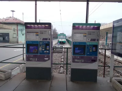 Two ticket machines on the HÉV platform at Szentendre. The left one takes coins and notes; the right one's screen reads "This machine accepts only bankcards".
