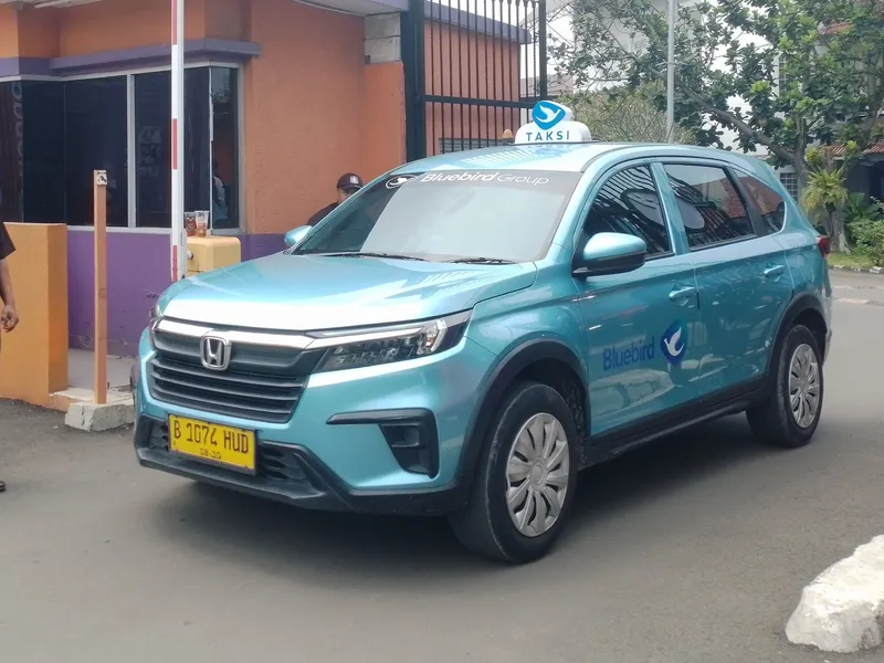 Sky-blue body, a TAKSI roof light and the bird logo: the one street taxi worth flagging