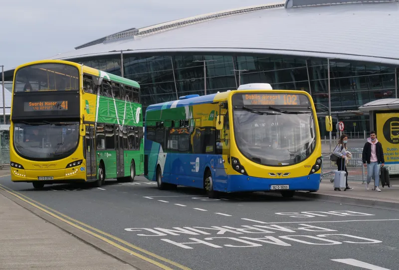 TFI route buses on the Terminal 2 side: a Dublin Bus 41 on the left - this one running via the airport out to Swords - and a Go-Ahead Ireland 102 on the right.