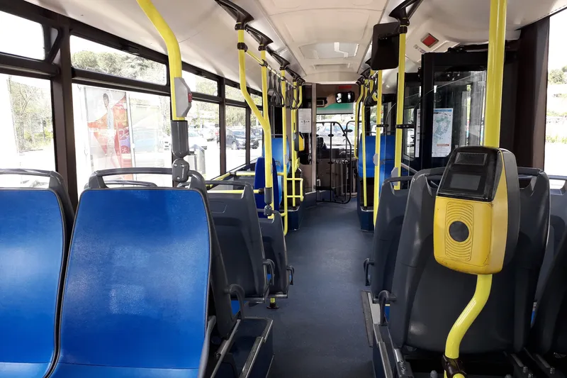 The yellow validator inside an ATAC bus — paper tickets go into the slot on top