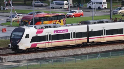 KLIA Transit runs the same line (this is the all-stops service) — same trains, same paint, so tell them apart by whether the side logo reads KLIA transit