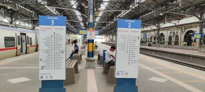 A KTM Komuter platform totem — under PLATFORM 2 it gives the destination (BATU CAVES) and the stops that way (Kuala Lumpur station)