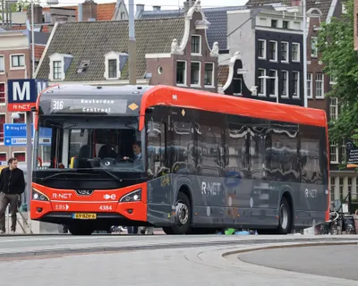 Regional buses out of the city are run by other companies - this is EBS on R-net line 316. The livery and the operator name differ from GVB's white-and-blue buses, and GVB day or multi-day tickets are not valid on them.