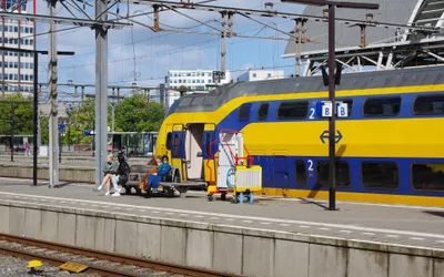 An NS double-decker at Amsterdam Centraal. The large "2" on the bodyside marks second class - the only class you may ride when you tap in with a bank card.