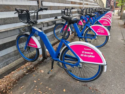 Bikes docked in a rack. Push the front wheel in firmly and do not walk away until the app confirms the return.