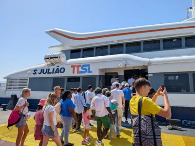 Passengers boarding the TTSL (Transtejo Soflusa) ferry Sao Juliao at Dock 3. These are commuter boats, not sightseeing cruises.