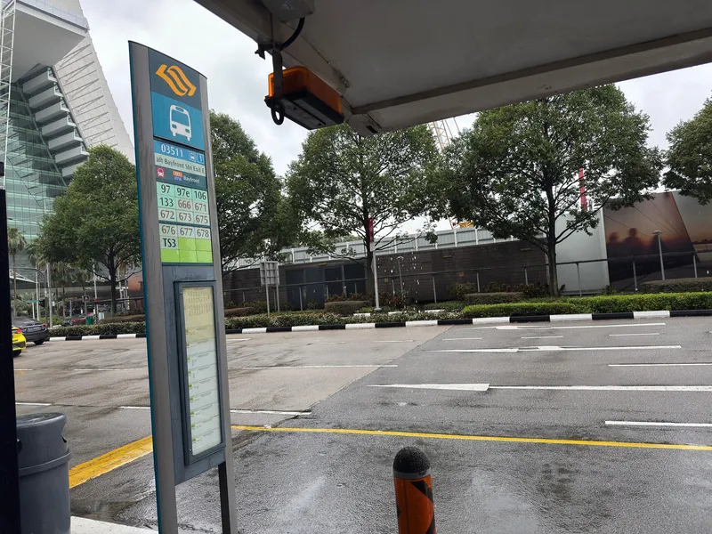 A bus stop pole: the five-digit stop code on top, the routes that call here listed below