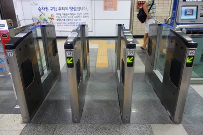 Fare gates at Hyehwa Station — touch the card to the reader on top of the gate