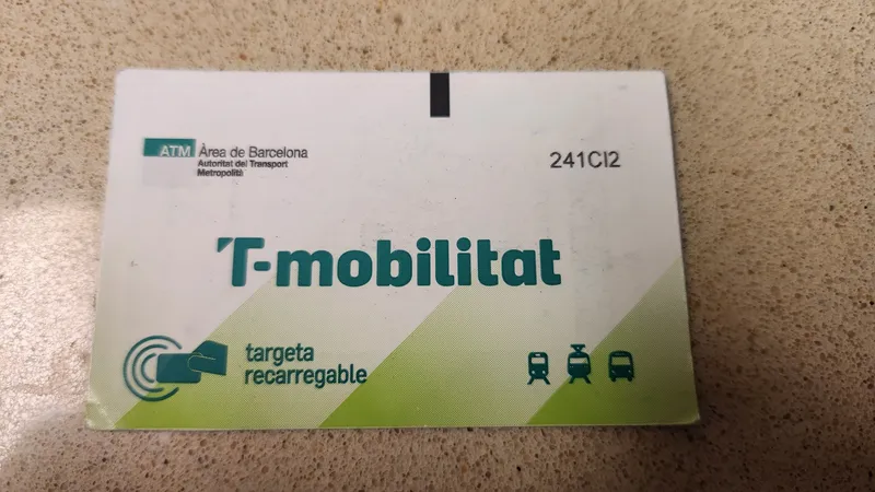 The cardboard T-mobilitat card — tickets bought at the machine are loaded onto it
