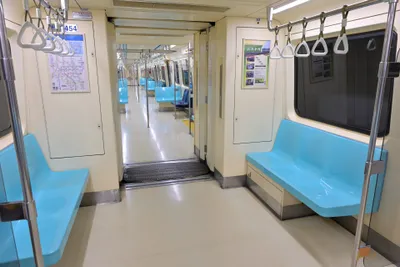 Inside a train — no eating or drinking past the gates, platforms included (water, gum and sweets too)