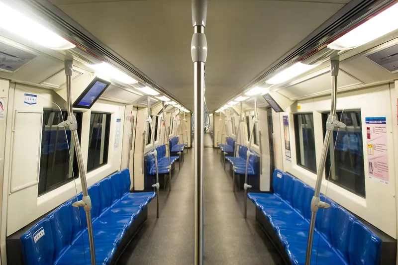Inside an MRT Blue Line train — eating and drinking are banned inside the gates and on board
