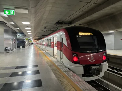 A Red Line train at Krung Thep Aphiwat — the commuter service runs these red EMUs