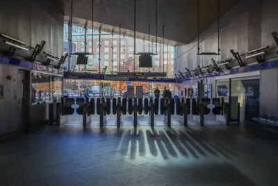 A Tube station gateline — tap out with the same card you tapped in with