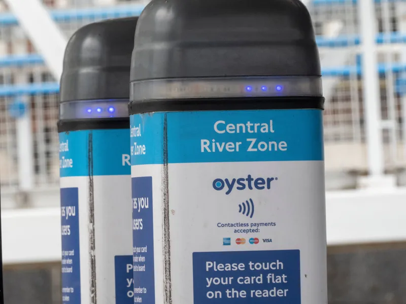The yellow reader on the gate — Oyster and contactless bank cards both tap here