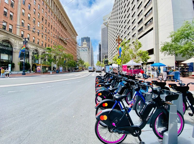A Bay Wheels station on Market Street — the black bikes carry a battery on the down tube
