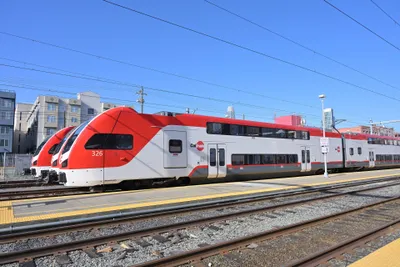 Caltrain trainsets at 4th & King station — red-and-white bi-level cars