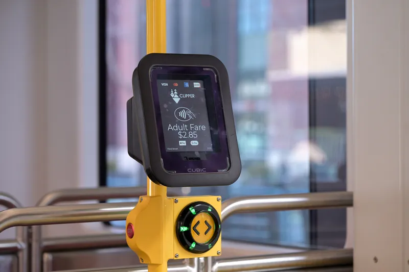 Fare reader inside a Muni car — the screen shows Visa, Mastercard, AMEX, Discover and Clipper, with the $2.85 adult fare
