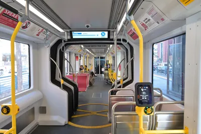 Inside a Muni Metro car (Siemens S200) — the reader sits on the yellow pole by the door